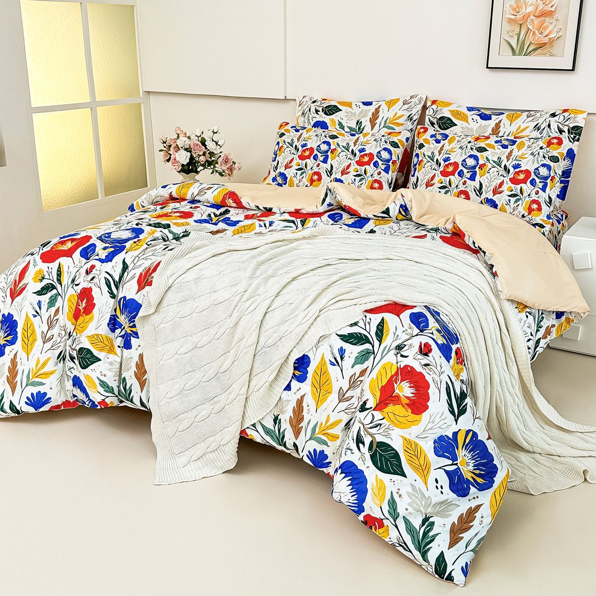 The floral comforter folded back to reveal its solid champagne-khaki reverse